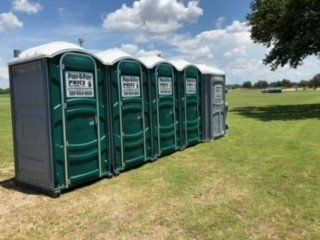 Portable Potty Delivery — Portable Toilets in Horizontal Line in Tampa Bay, FL Portable Potty Delivery — Portable Toilets in Horizontal Line in Tampa Bay, FL