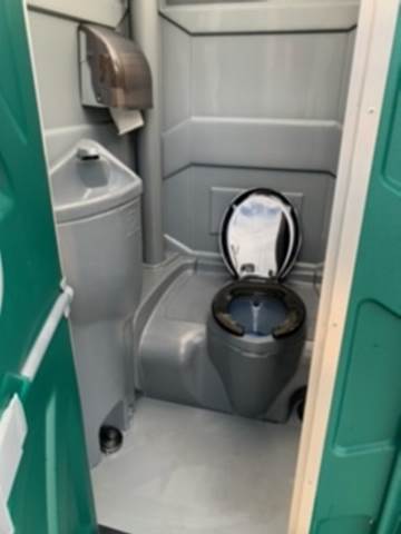 Flushable Unit with Sink — Portable Toilet on Park in Tampa Bay, FL Flushable Unit with Sink — Portable Toilet on Park in Tampa Bay, FL