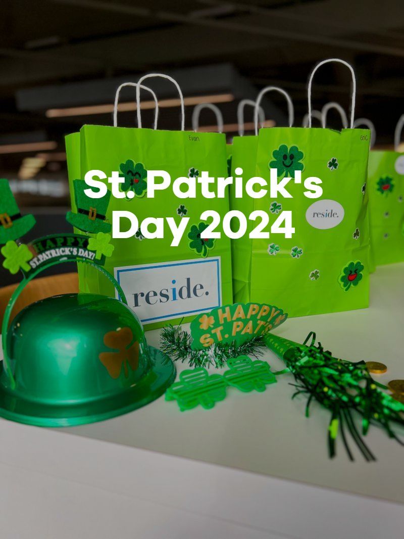 St. Patrick’s Day 2024 green gift bags with shamrock decorations and a green hat on a table