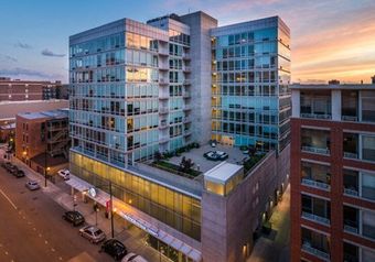 An aerial view of a large building with a lot of windows.