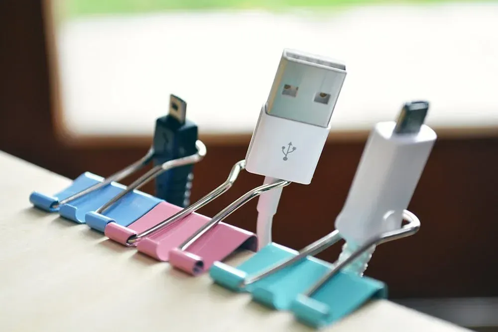 A bunch of binder clips with usb connectors attached to them