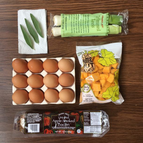 A tray of eggs next to a bag of pumpkin