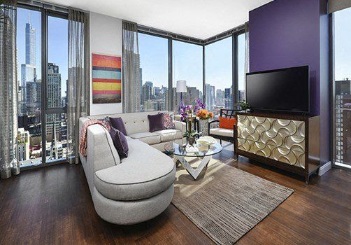A living room with a couch and a flat screen tv