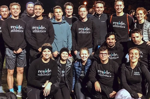 A large group of people in matching black