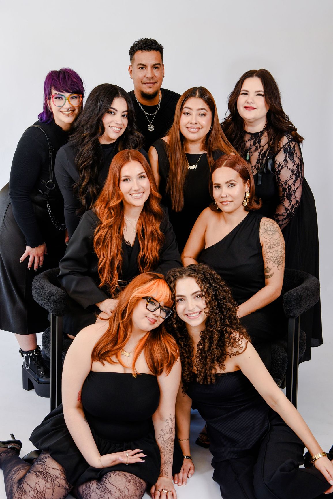 A group of women are posing for a picture in a room.