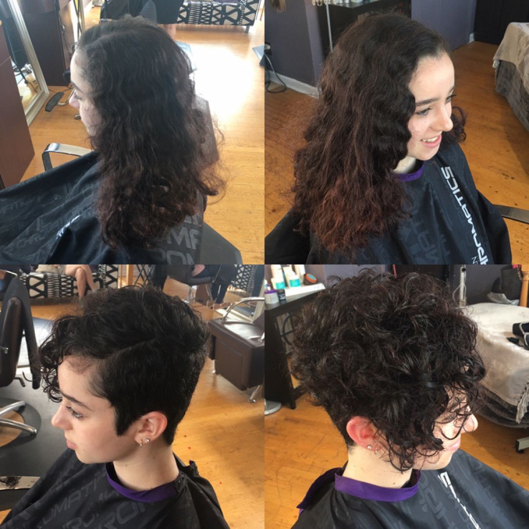 A woman with curly hair is getting her hair cut