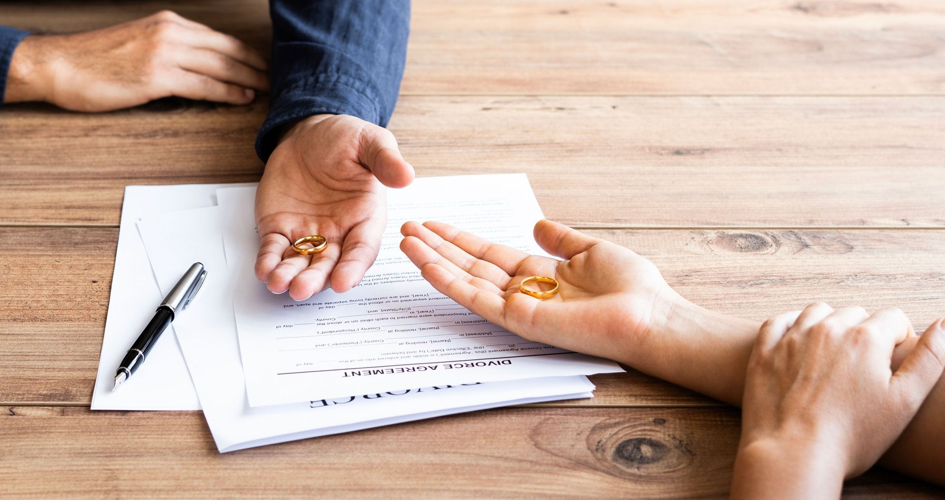 Human hand signing divorce contract. Human hand signing divorce contract.
