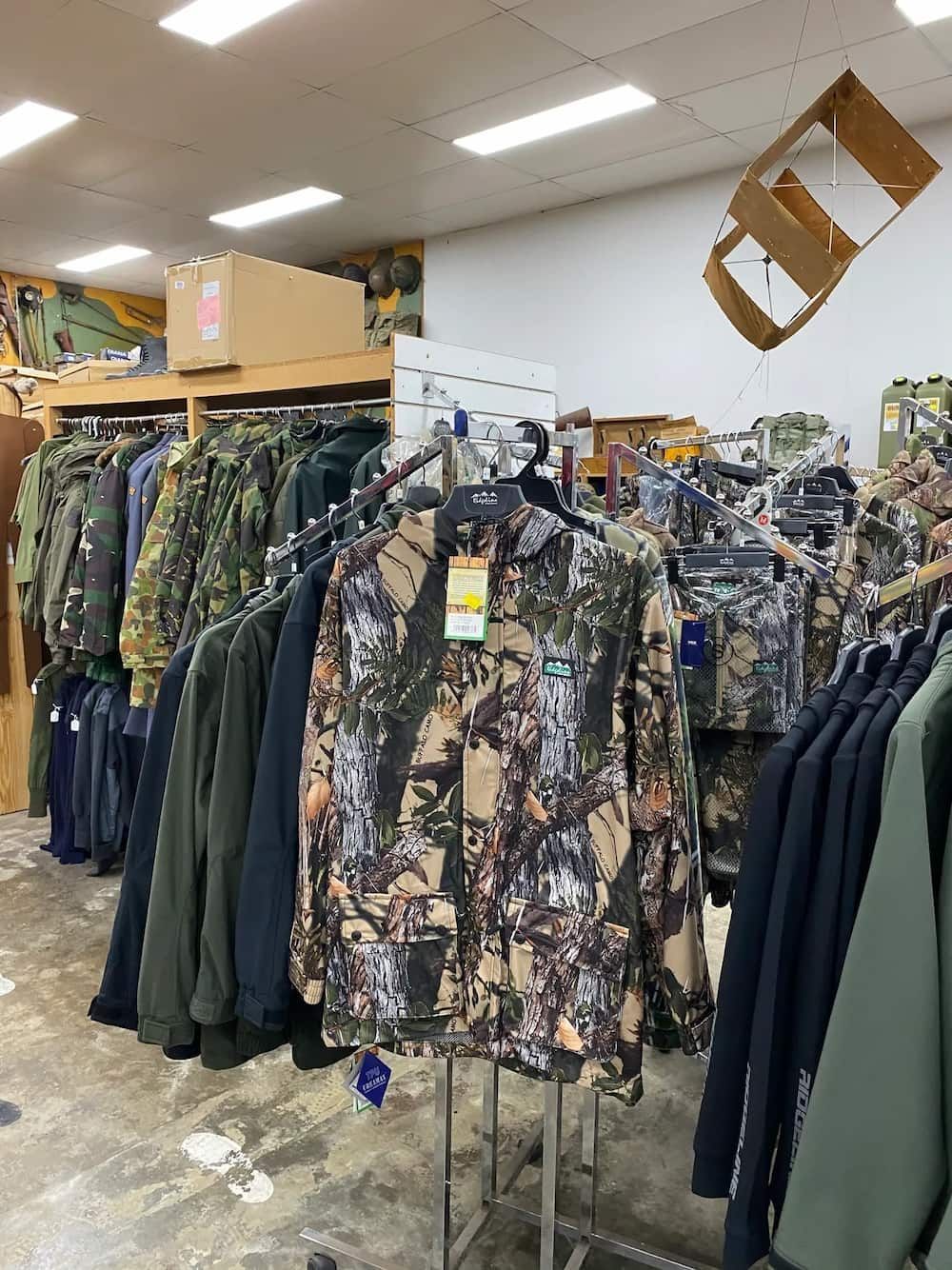 Lots Of Clothes Hanging On Racks — Coffs Disposals, Workwear, Safety & Boot Centre in Coffs Harbour, NSW