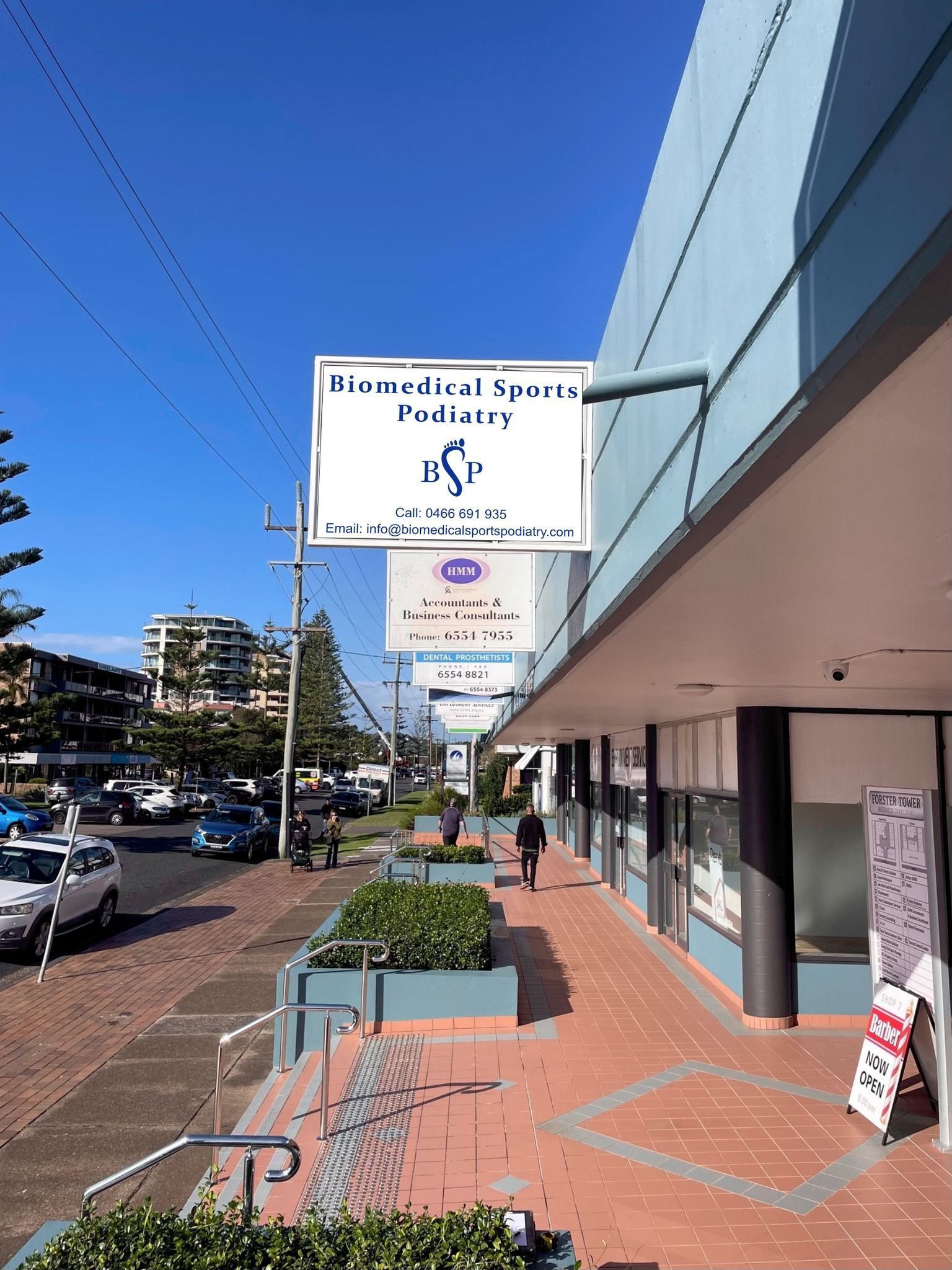 the outside of a shop with a Biomedical Sports Podiatry sign — Biomedical Sports Podiatry in Diamond Beach, NSW