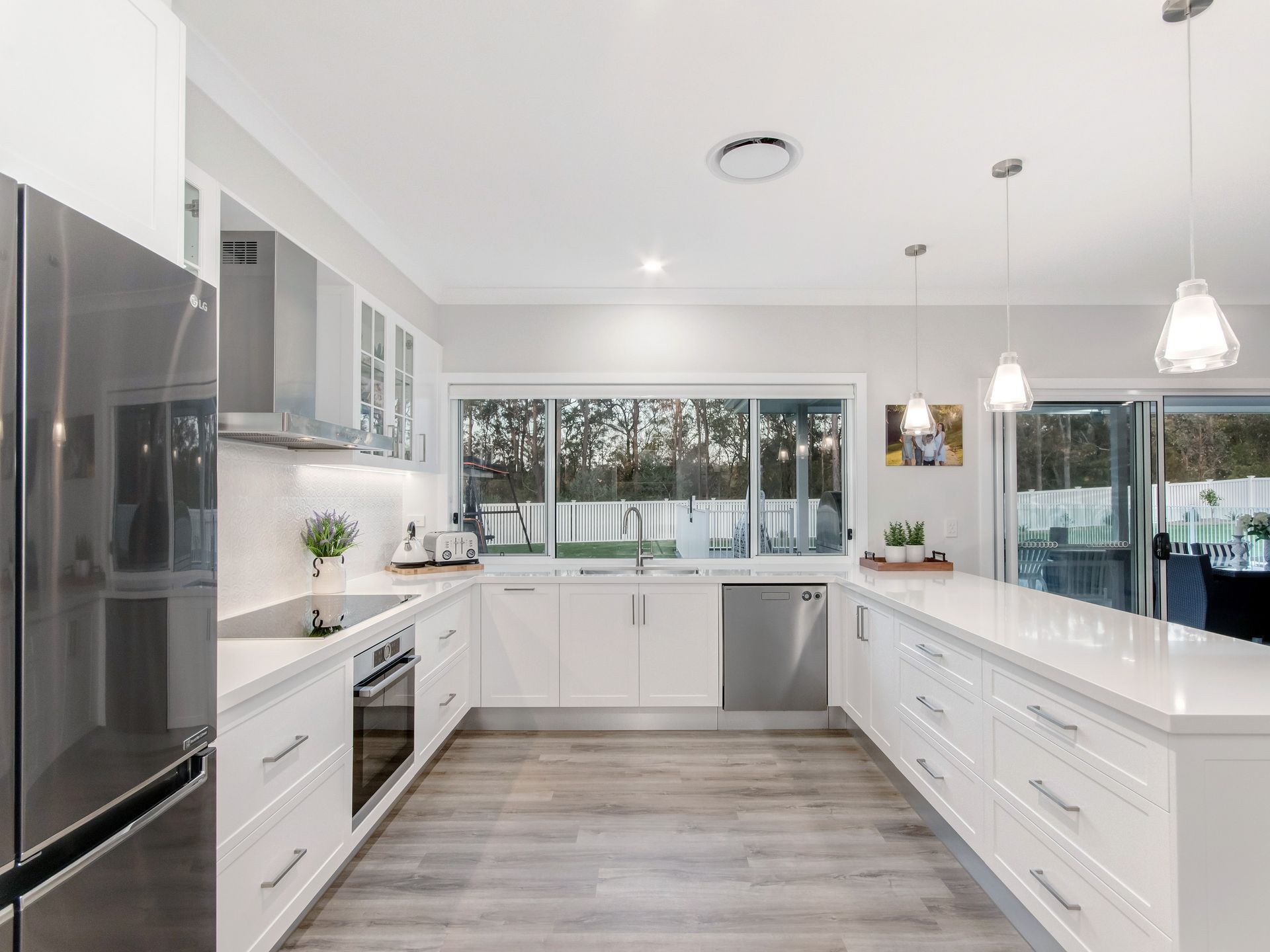 A Laundry Room With Cabinets and a Window — Michael Duncan Constructions Pty Ltd in Burleigh Heads, QLD