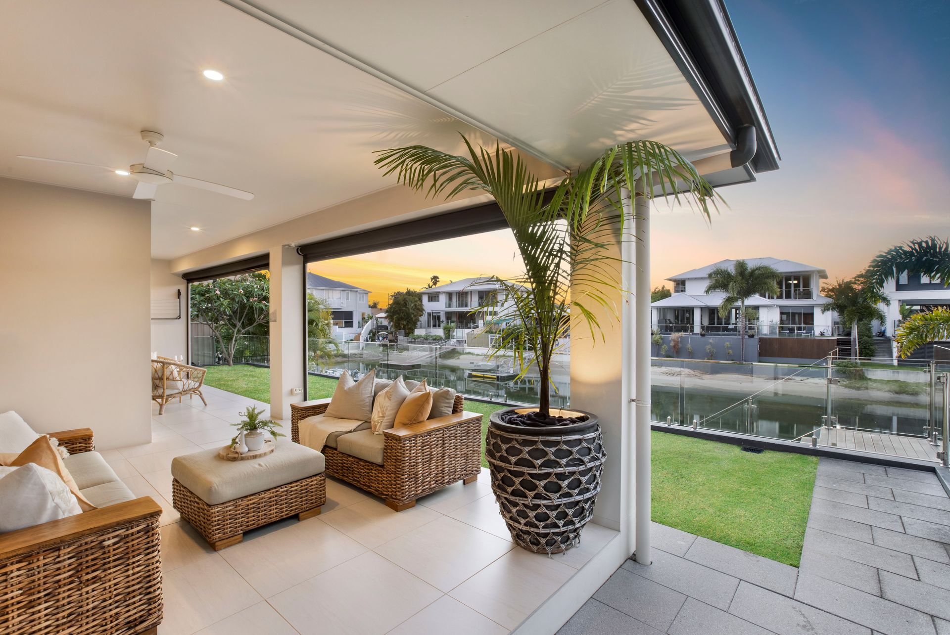 A Patio With a Table and Chairs and a Swimming Pool — Michael Duncan Constructions Pty Ltd in Burleigh Heads, QLD
