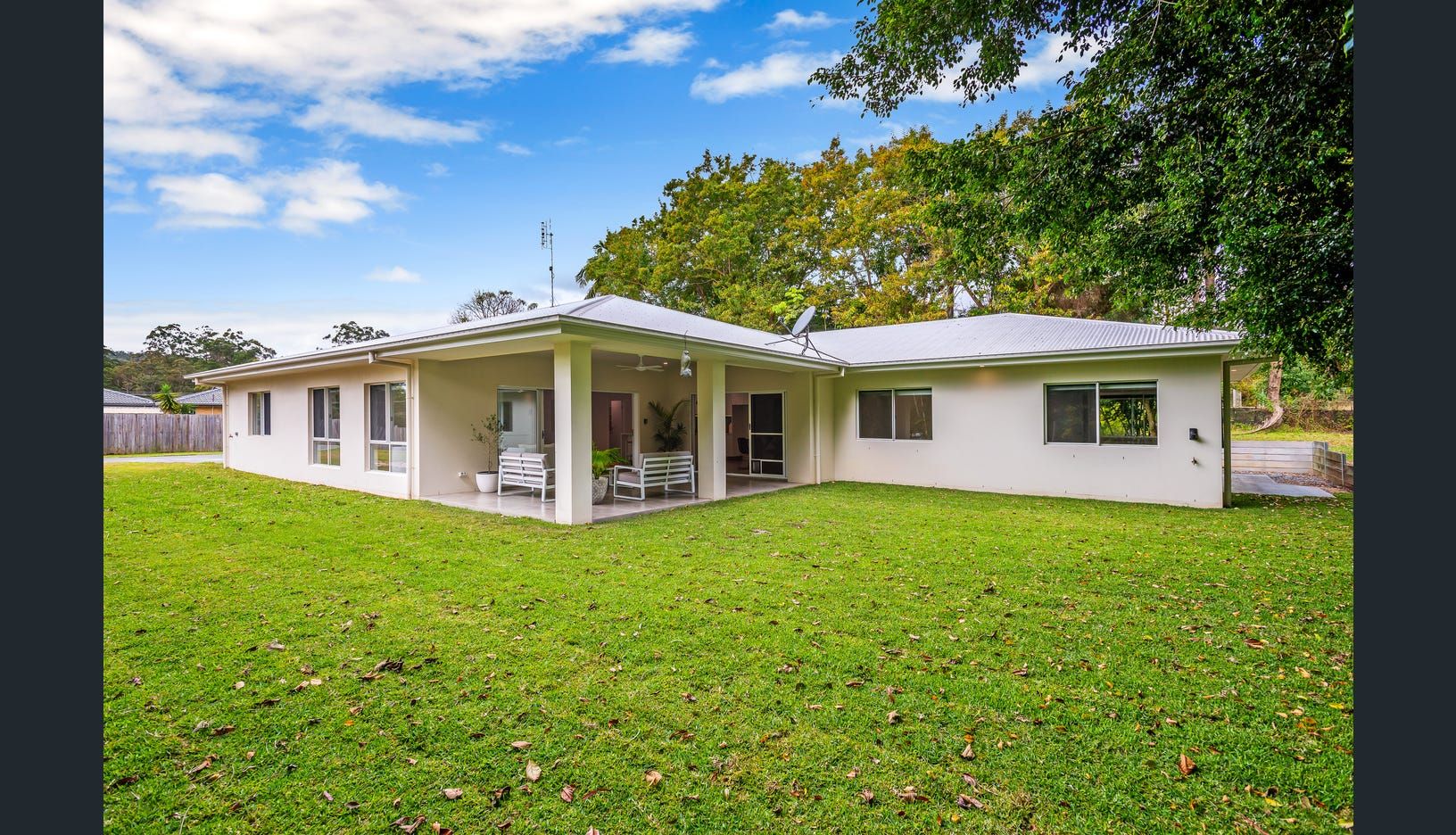 A Bedroom With a Bed and Dresser — Michael Duncan Constructions Pty Ltd in Robina, QLD