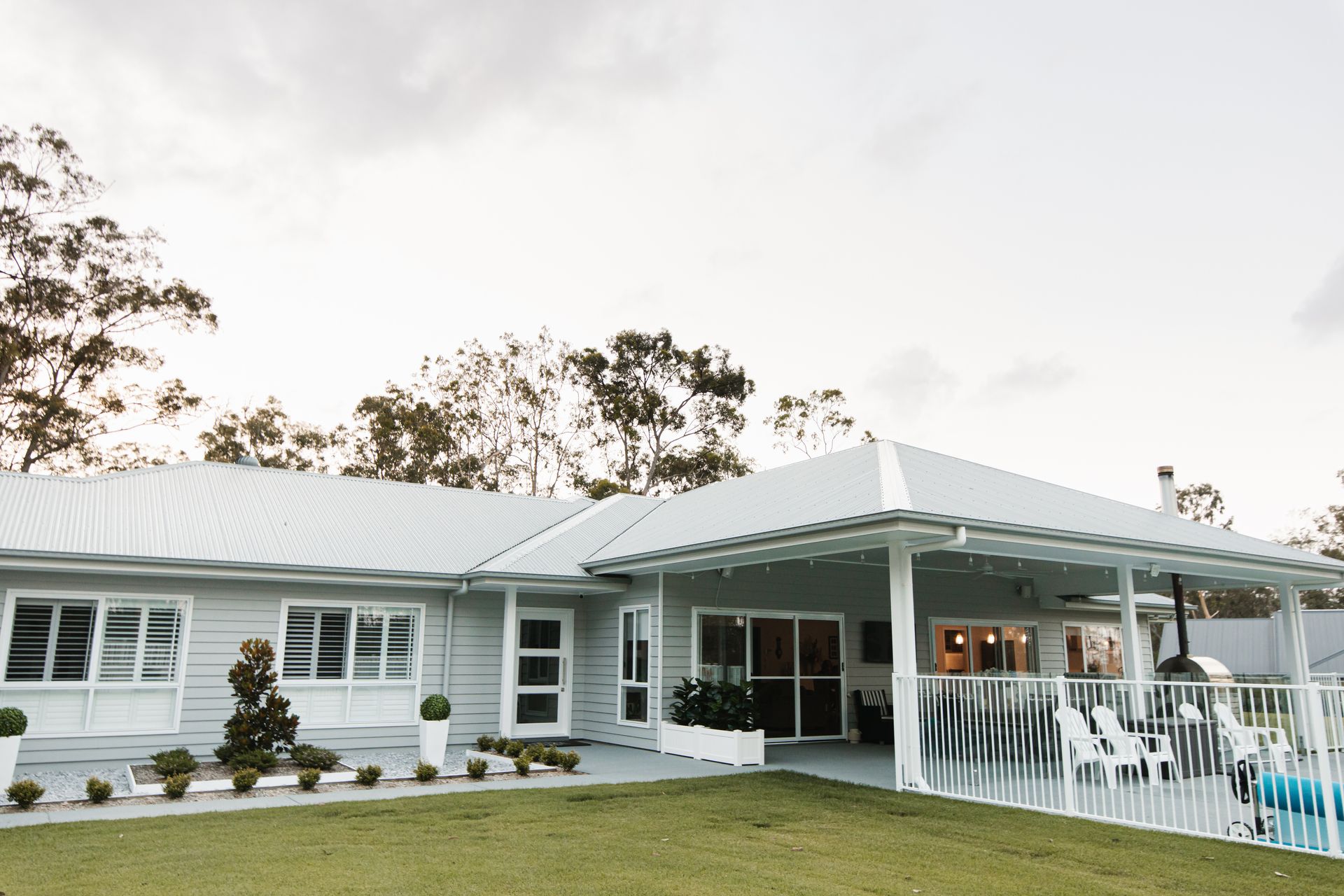 A Large Patio With a Swimming Pool and a Table and Chairs — Michael Duncan Constructions Pty Ltd in Mermaid Beach, QLD