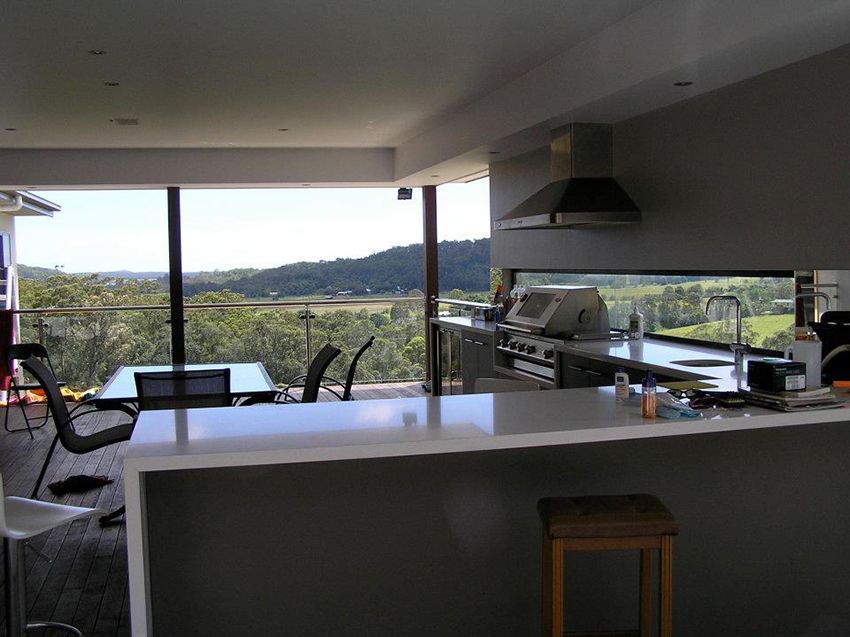 A Kitchen With a View of a Lush Green Field — Michael Duncan Constructions Pty Ltd in Robina, QLD
