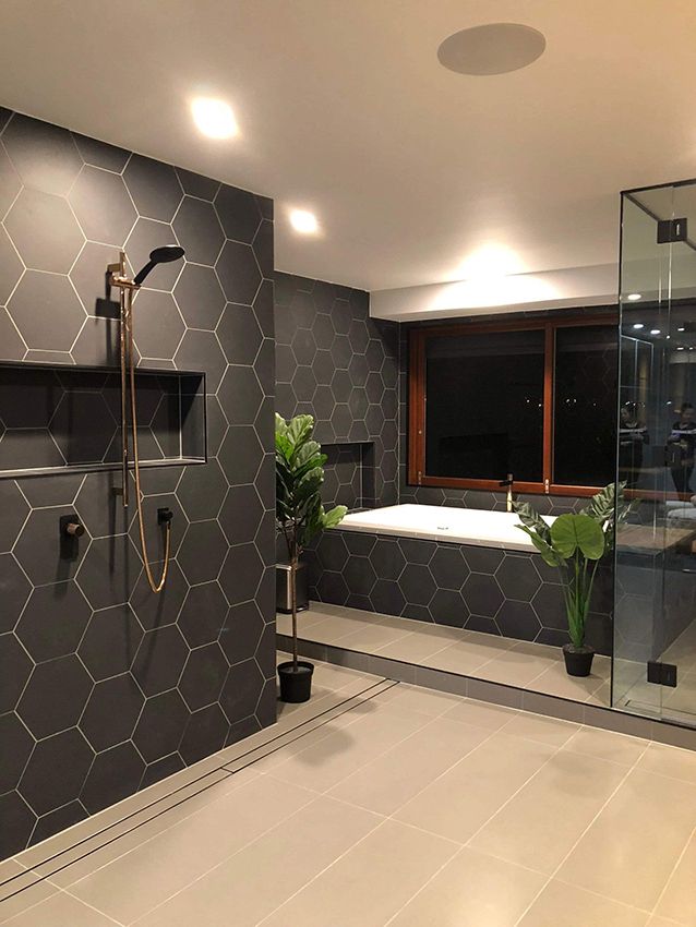 A Bathroom With a Tub, Shower, and Window — Michael Duncan Constructions Pty Ltd in Robina, QLD