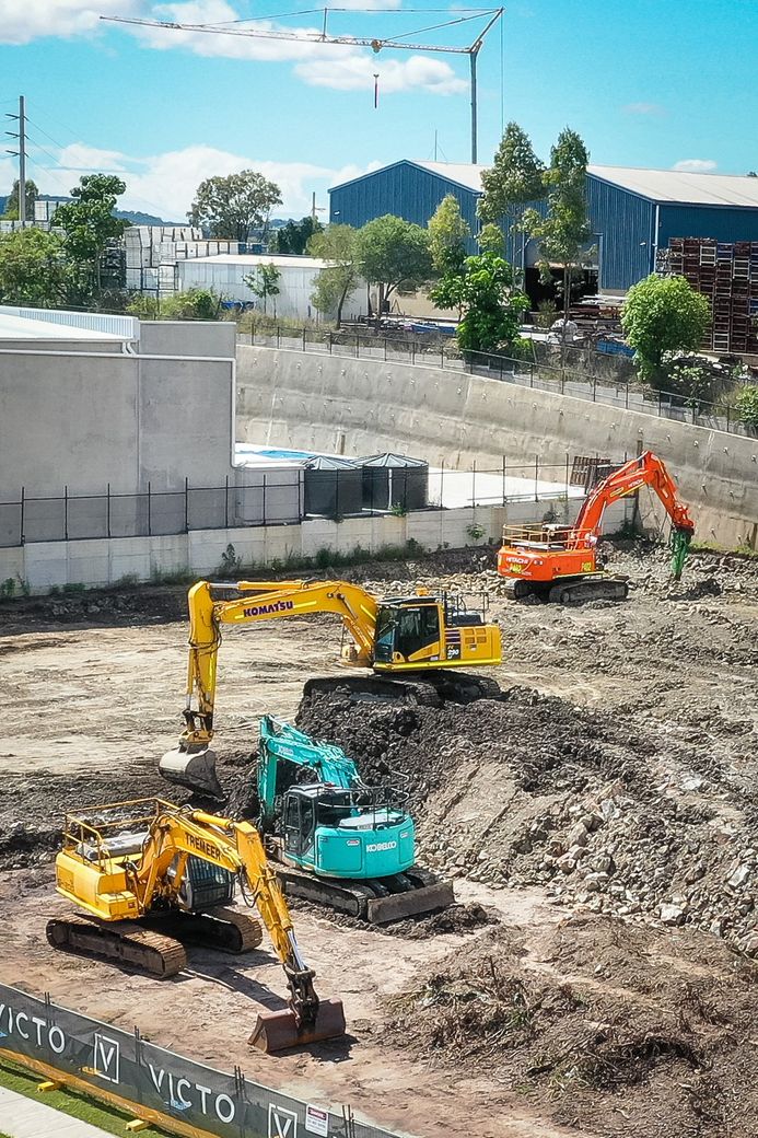 Victo construction site excavators working Victo construction site excavators working
