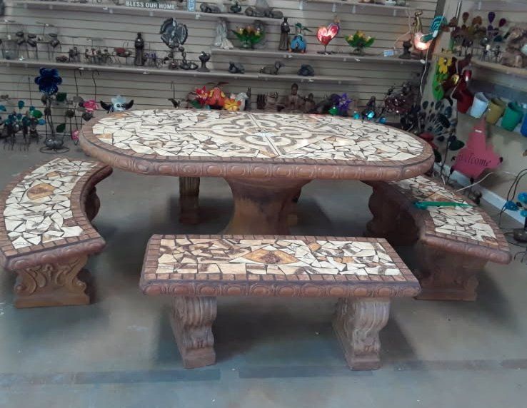 Stone mosaic outdoor table with matching benches in a market display