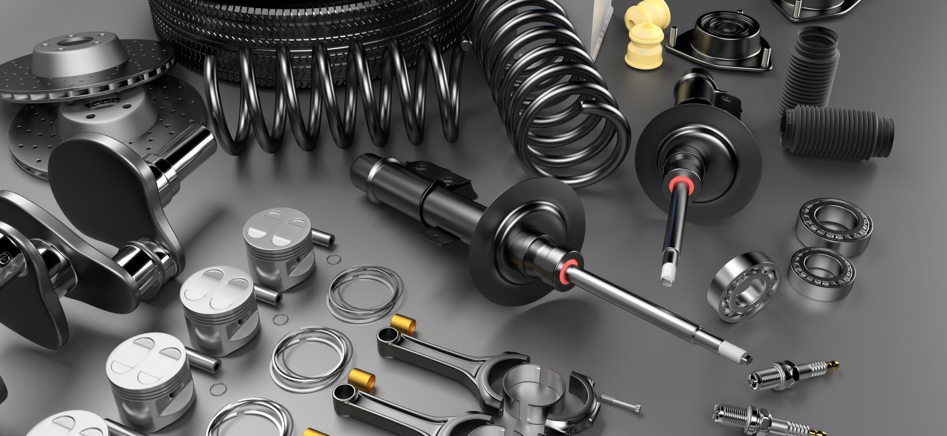 Used auto parts for sale, spare on a grey background.