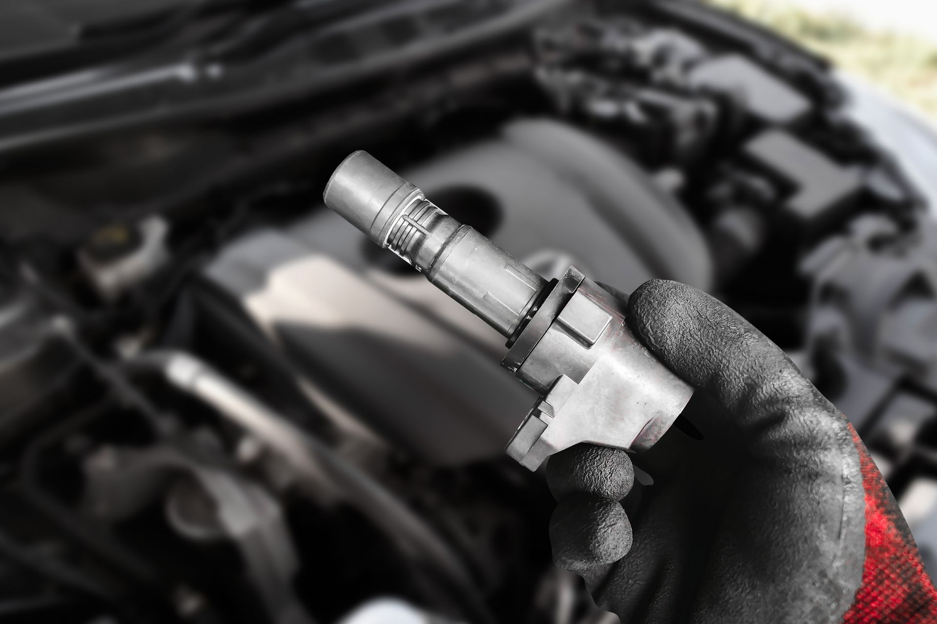 Used car parts being inspected by an automotive technician.