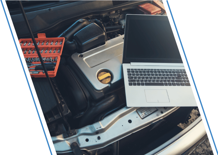 Laptop computer connected to a vehicle for diagnostic testing.