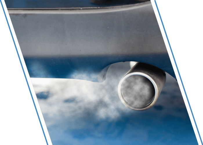 Exhaust pipe emitting visible emissions from the rear of a vehicle.
