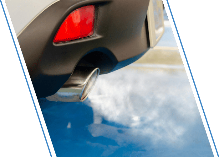 Rear exhaust tip with visible exhaust vapor.