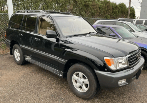 Black Toyota Land Cruiser SUV parked outdoors in a parking lot