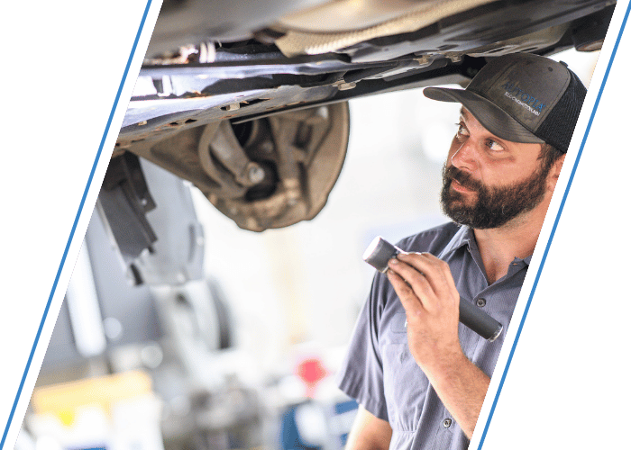 Vehicle interior undergoing routine electronic diagnostics during scheduled maintenance.