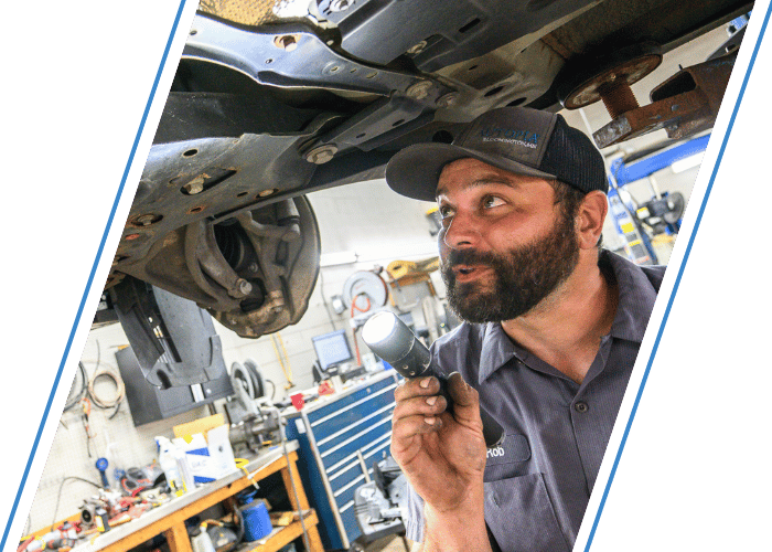 Engine bay with air filter removed during spark plug replacement and tune-up service.