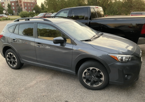 Gray Subaru Crosstrek crossover SUV parked outdoors in a parking lot