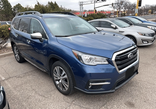 Blue Subaru Ascent SUV parked outdoors in a parking lot