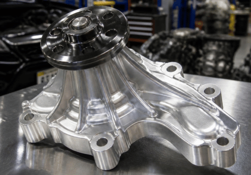 Close-up of a new automotive water pump on a workbench