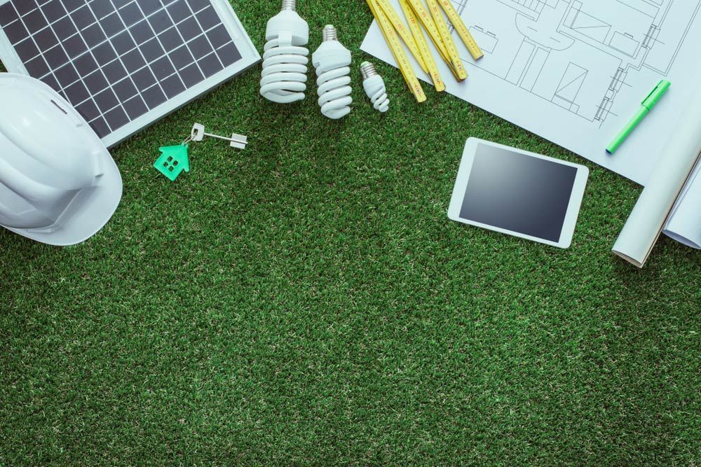 Green Grass Scattered with Various Construction Materials and Tools — Hager Surveying In Burleigh Heads, QLD