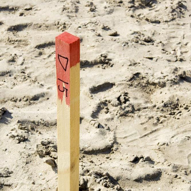 A Wooden Pole with The Number 4/5 on It — Hager Surveying In Kingscliff, NSW