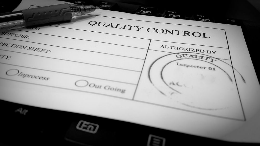 A Piece of Paper that Says Quality Control on It — Hager Surveying In Robina, QLD