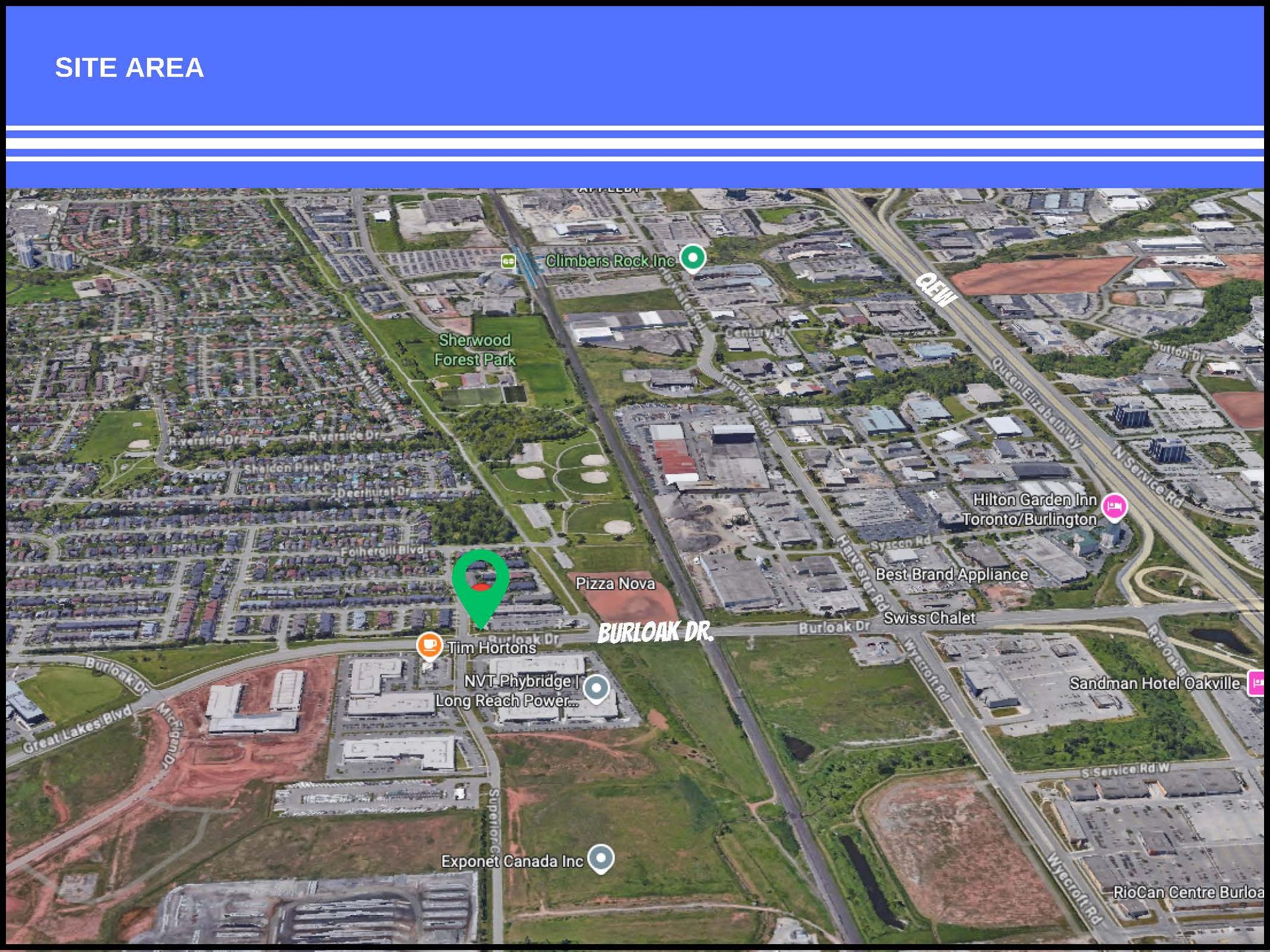 Aerial satellite view of a neighborhood featuring a marked site location with a green pin, urban roads, and green spaces.