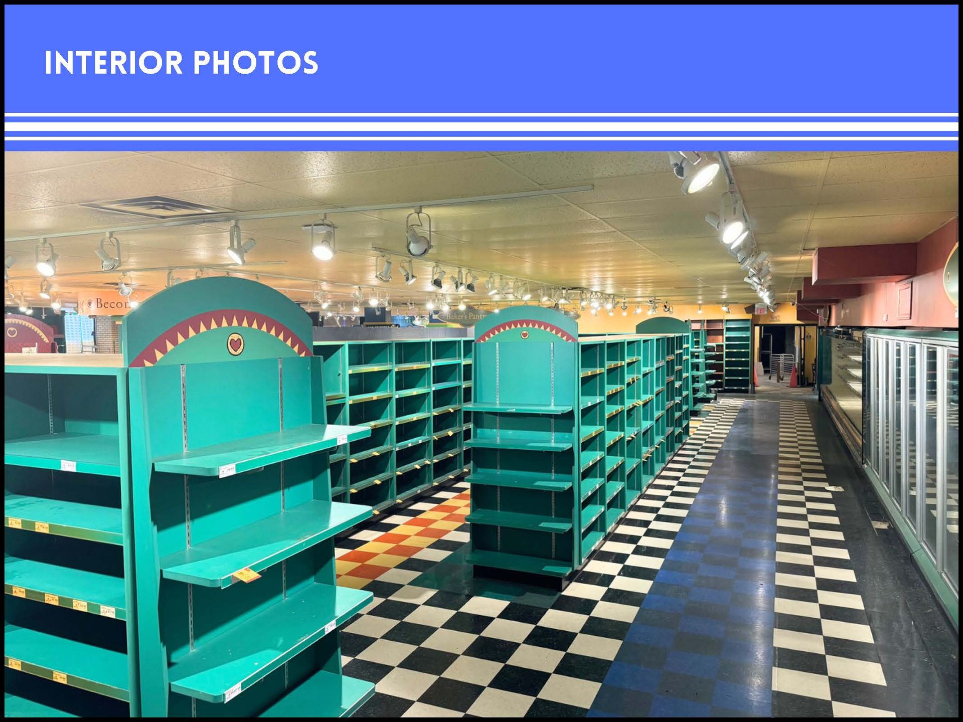 An empty retail space with teal shelving units arranged in rows over a black-and-white checkered floor.
