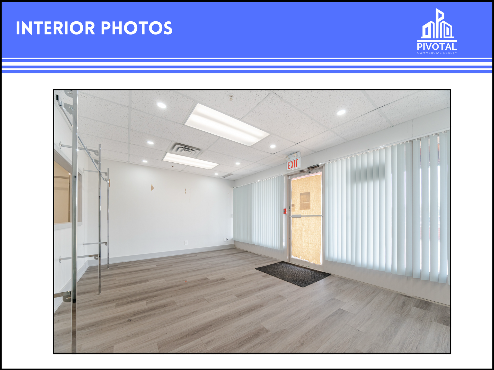 Empty modern office room with light wood flooring, white walls, drop ceiling, and a glass door with blinds.
