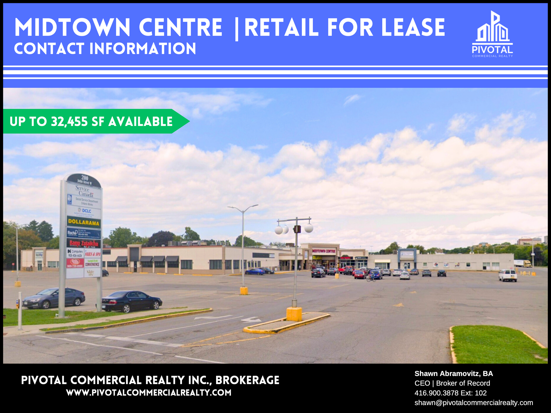 Midtown Centre retail plaza for lease, featuring a large parking lot and a tall directory sign under a cloudy blue sky.
