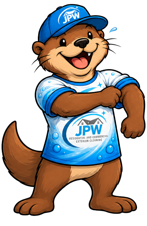 Cartoon beaver mascot in a blue JPW cap and shirt, smiling with arms crossed.