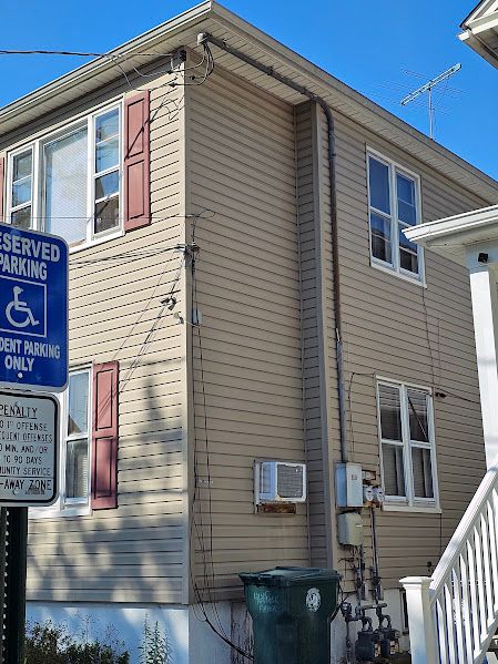 Existing two-family electrical service before upgrade