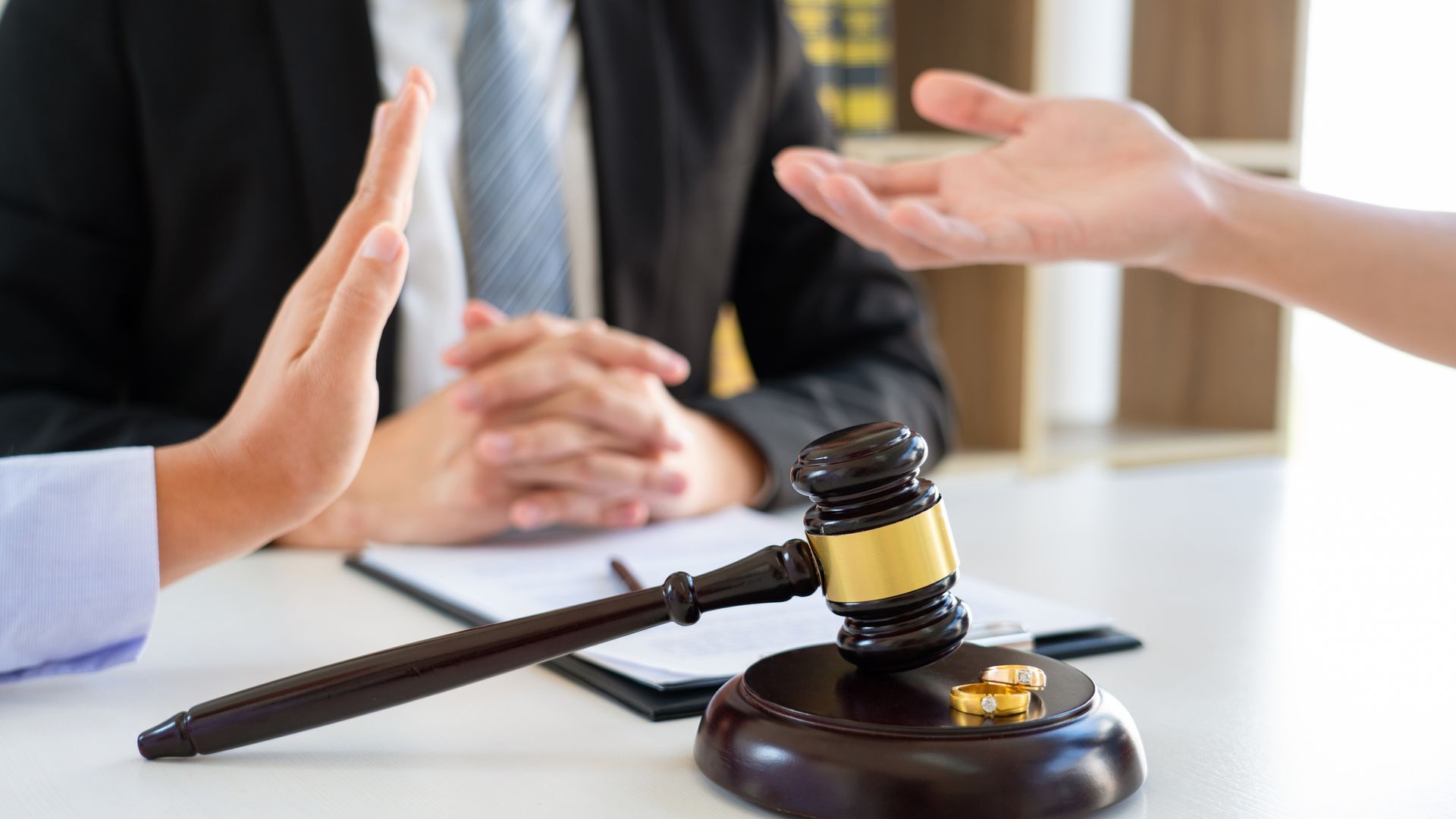 Couple husband and wife during divorce process with a No-Fault Divorce Attorney for legal guidance.