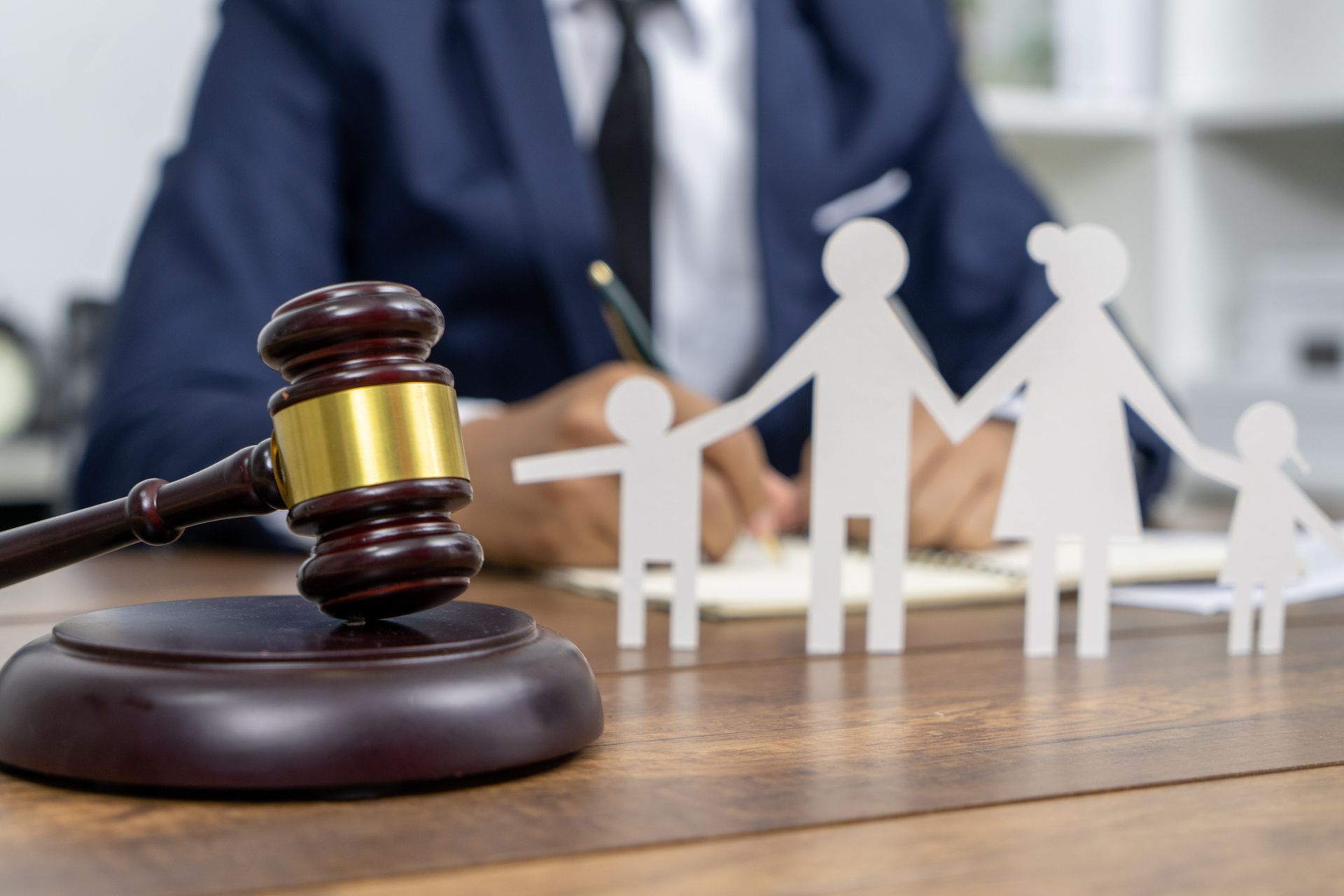 A family law attorney reviewing case documents to prepare for a client consultation.