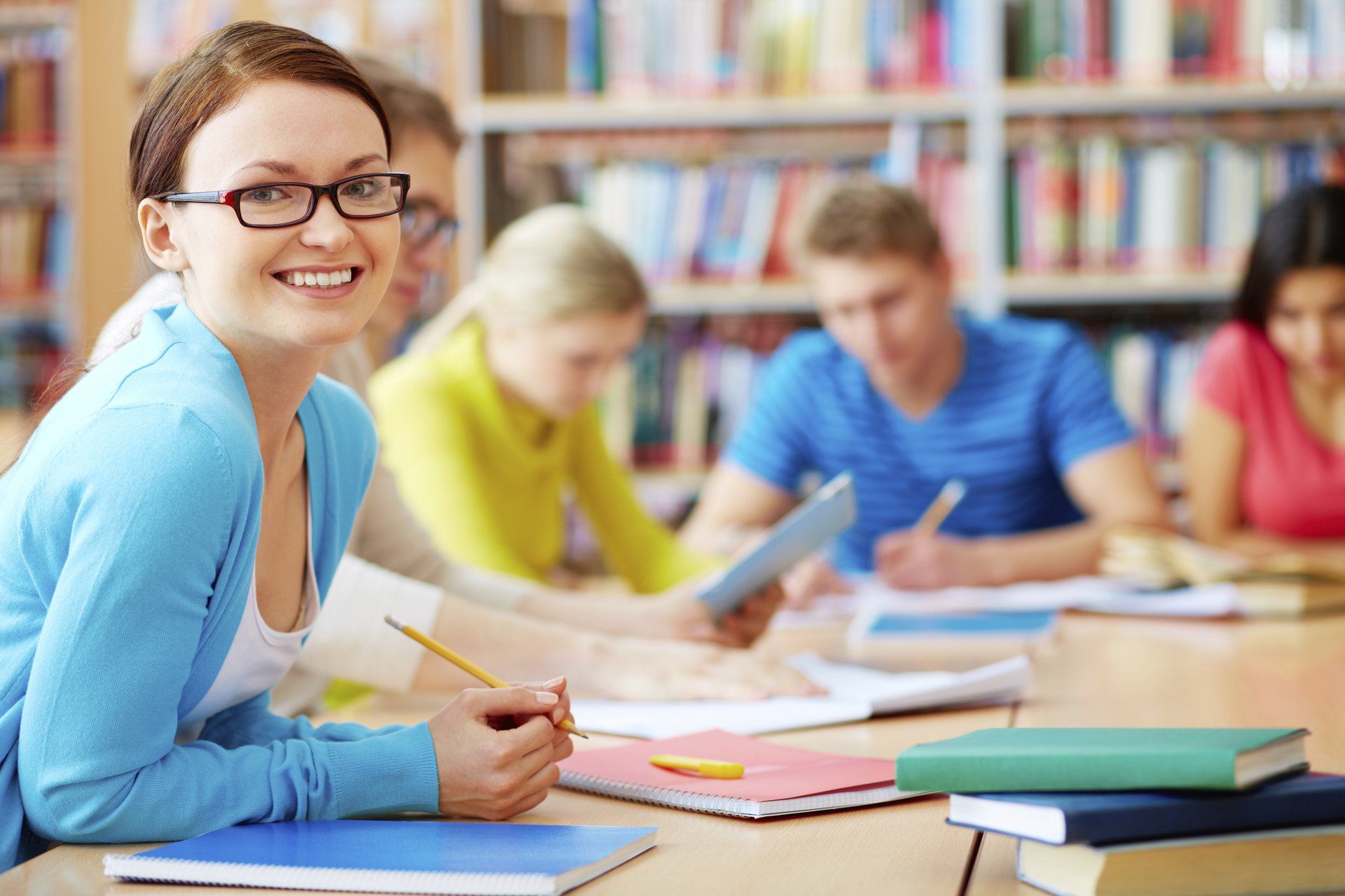 Girl smiling on a group study — Daytona Beach, FL — Monarch Academy