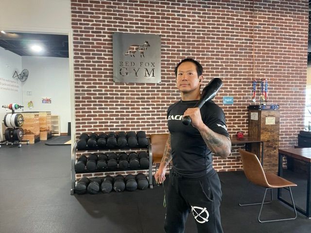 Tim training with a club in the gym