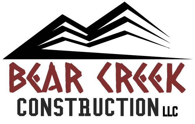 Logo for Bear Creek Construction featuring stylized mountain range over text.