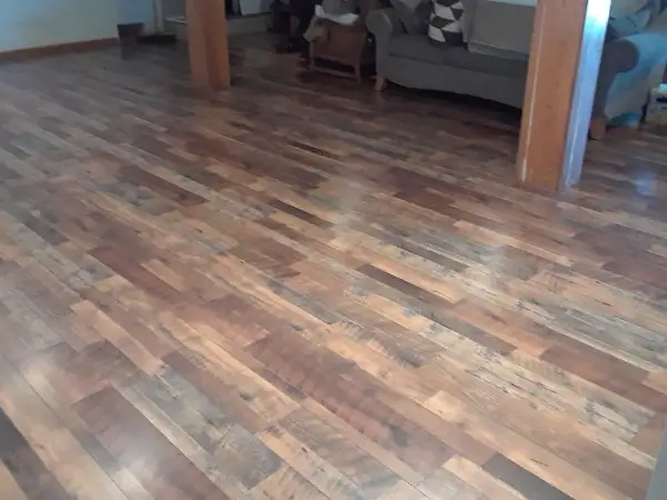 Wood plank floor with varying shades of brown and natural wood grain.