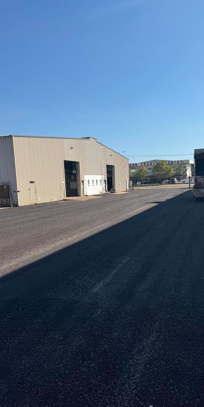 An Empty Parking Lot With Trees In The Background — Territory Bitumen Services In Tivendale, NT