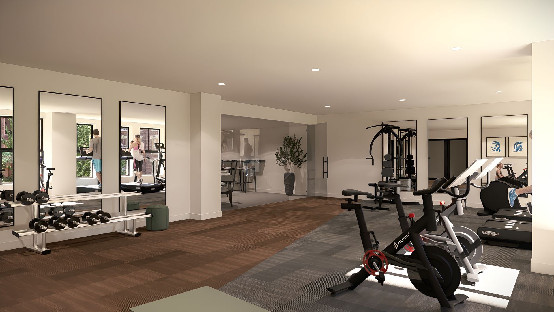Apartment community gym featuring treadmills, free weights, and workout stations