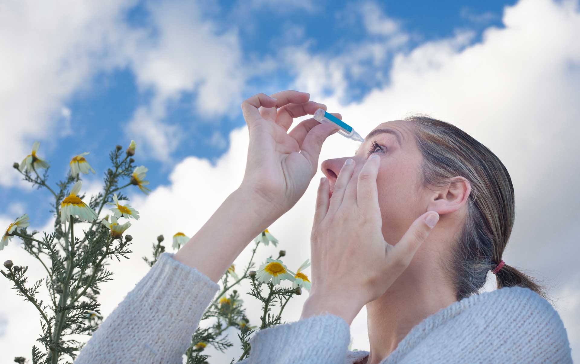 Young woman using eyedropper — Kentucky and Tennessee — Calvert Ophthalmology